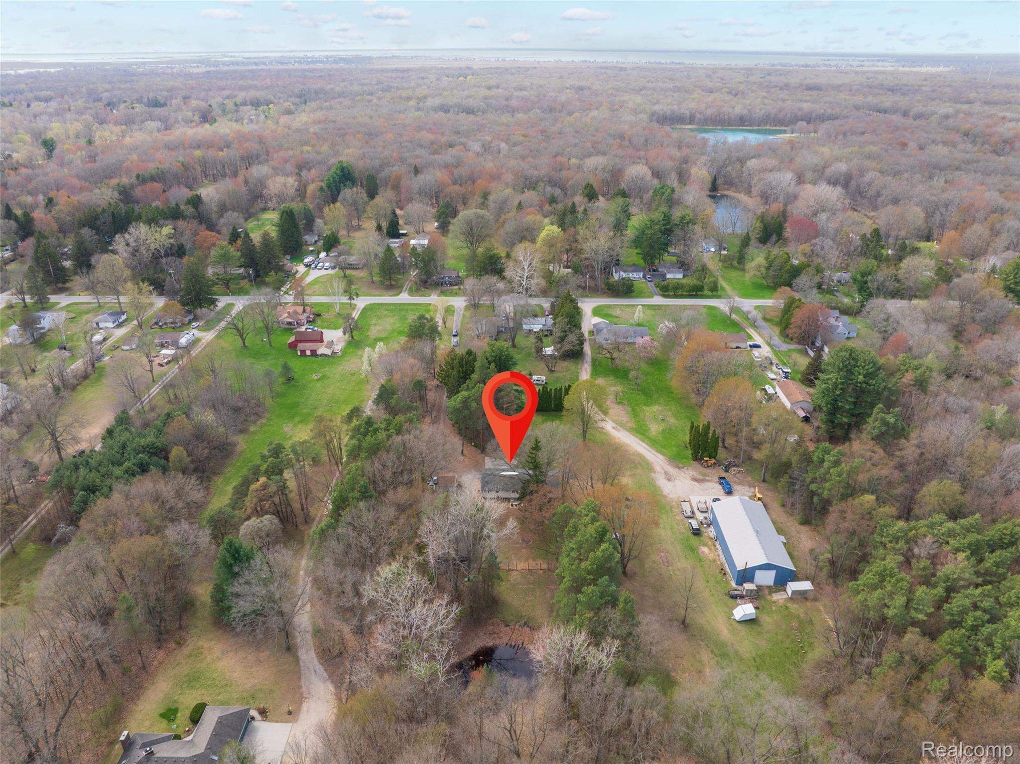 8639 Stone Road Algonac, MI 48001 - Photo 23 of 31 Aerial view of a nearby body of water and a forest