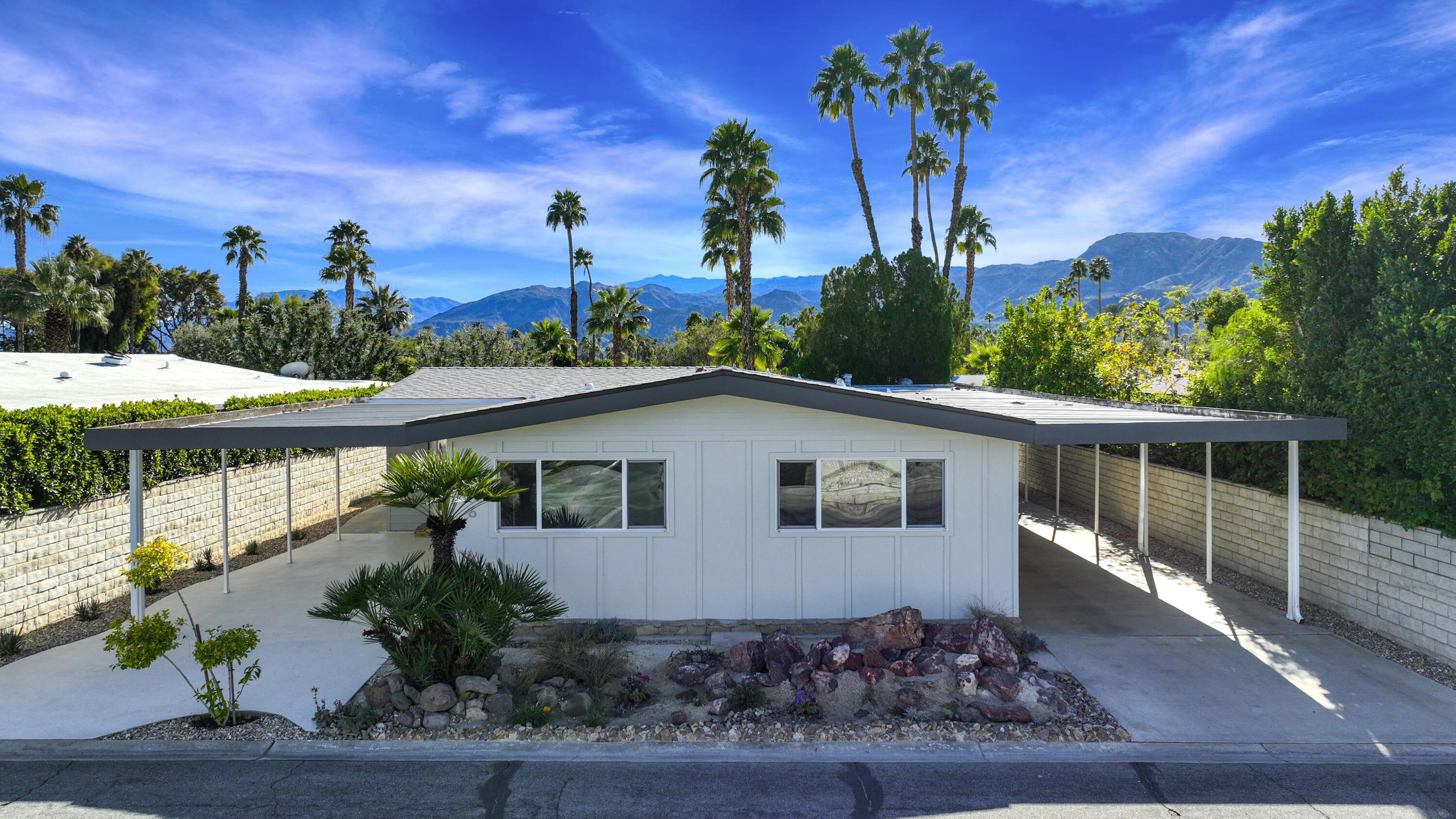 126 Monte Carlo Street Rancho Mirage, CA 92270 - Photo 1 of 33 a front view of a house with a yard