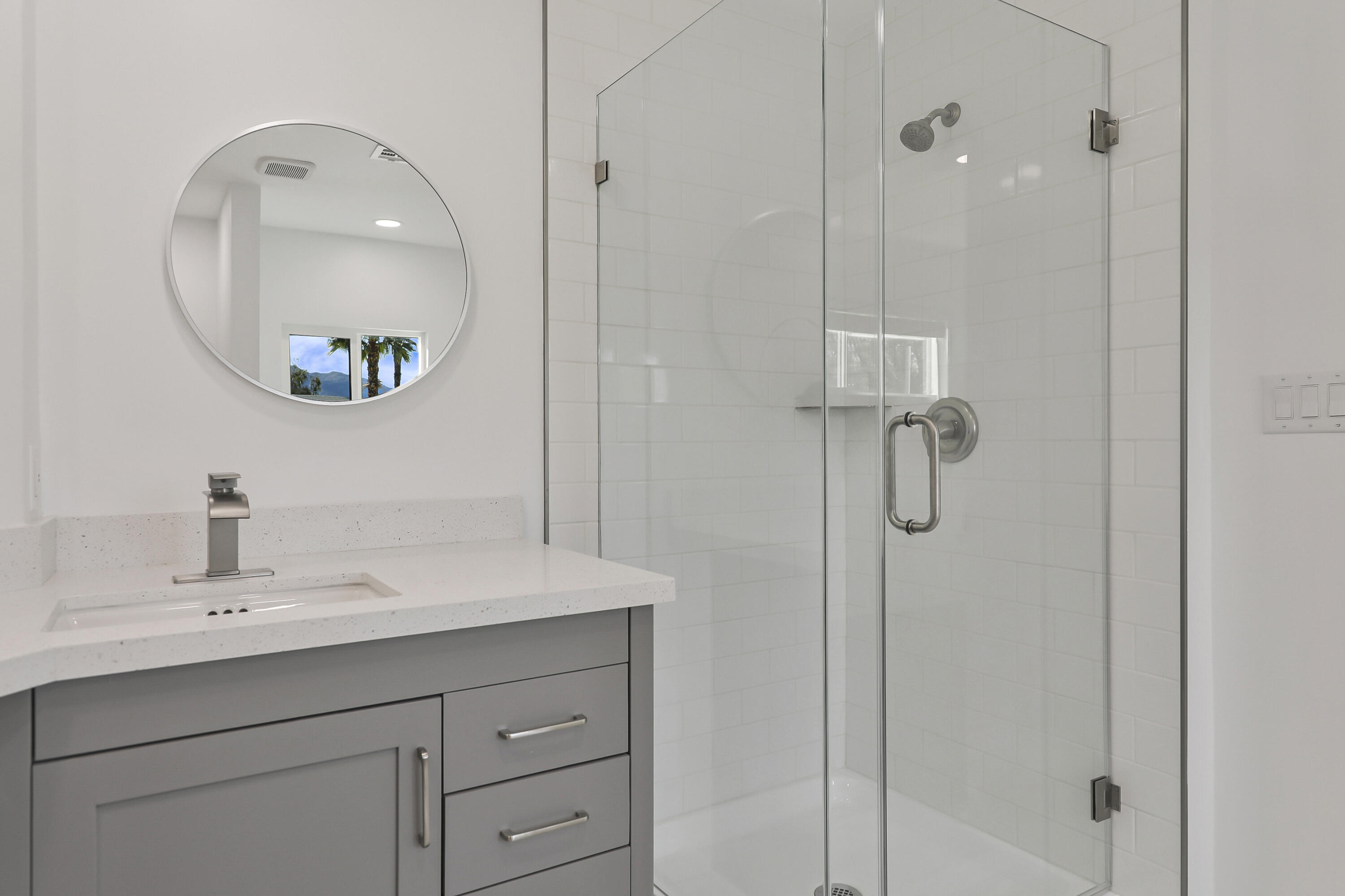 126 Monte Carlo Street Rancho Mirage, CA 92270 - Photo 21 of 33 a bathroom with a sink a mirror a vanity and a shower