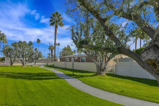 a view of a playground with basketball court