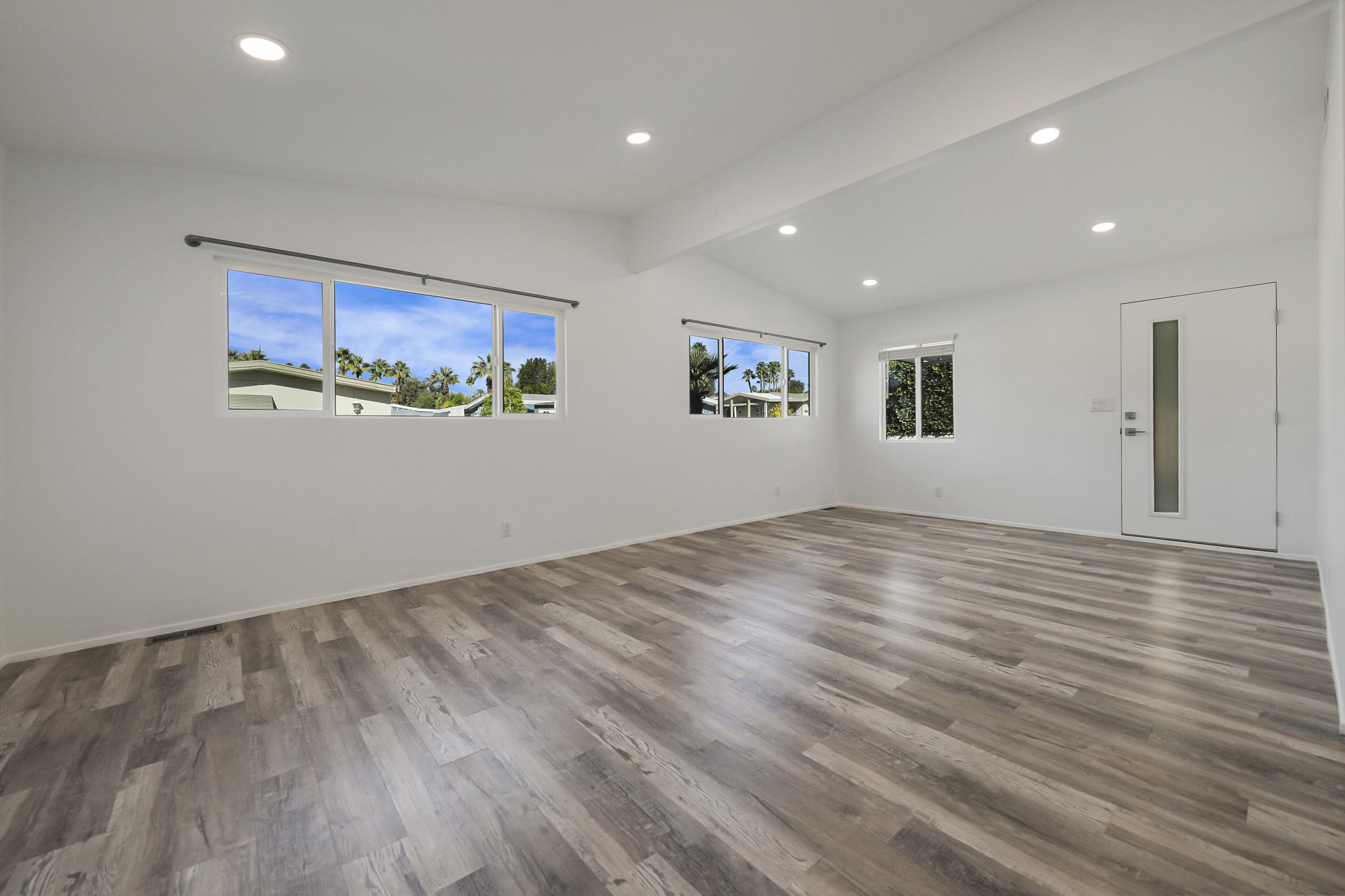 126 Monte Carlo Street Rancho Mirage, CA 92270 - Photo 7 of 33 a view of a room with wooden floor and window