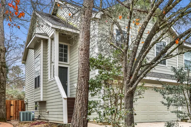 a view of a house with a tree