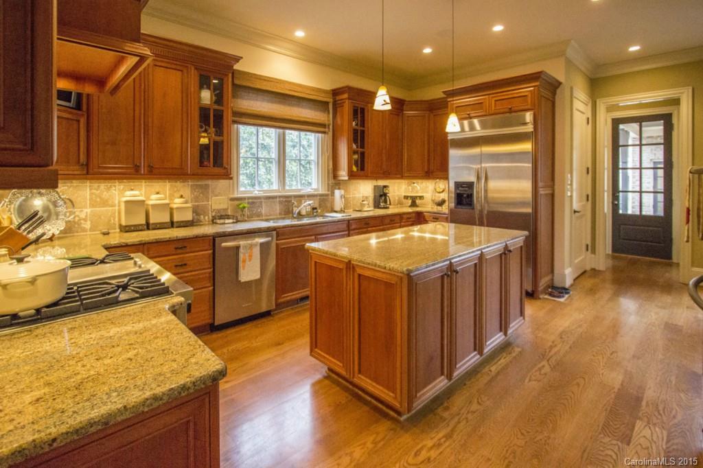 1930 Harris Road Charlotte, NC 28211 - Photo 12 of 21 a kitchen with sink stove and cabinets