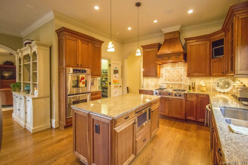 1930 Harris Road Charlotte, NC 28211 - Photo 13 of 21 a kitchen with a sink appliances and cabinets