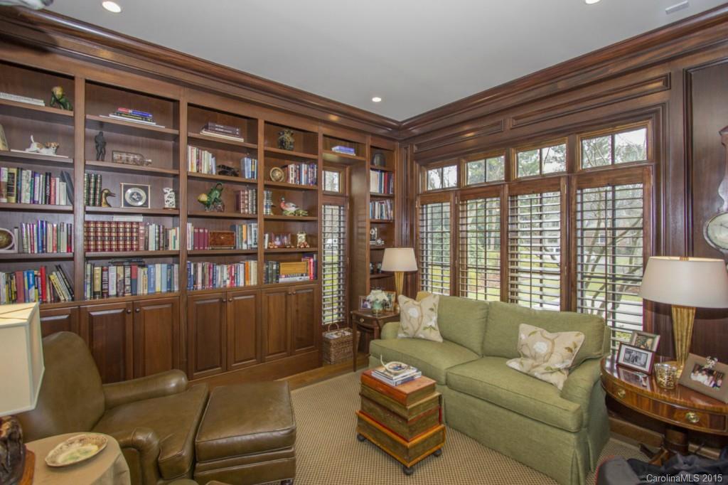 1930 Harris Road Charlotte, NC 28211 - Photo 8 of 21 a living room with furniture and a book shelf