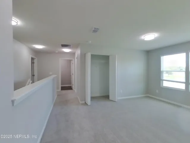 a view of hallway with stairs
