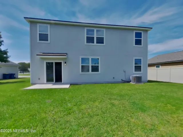 a view of a house with a garden
