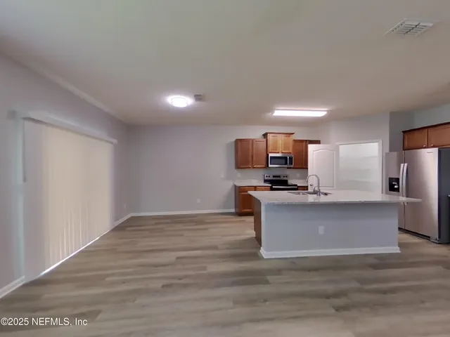 a view of kitchen with microwave oven