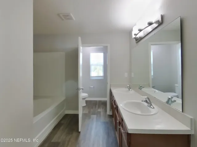 a bathroom with a sink and a bathtub