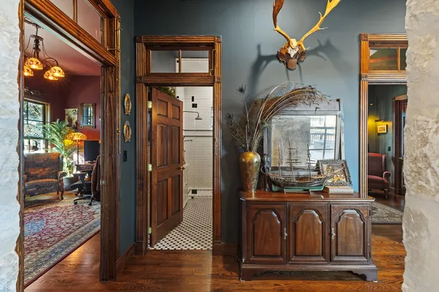 a living room with furniture rug and window