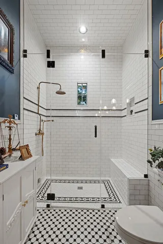 a living room with furniture a window and a flat screen tv