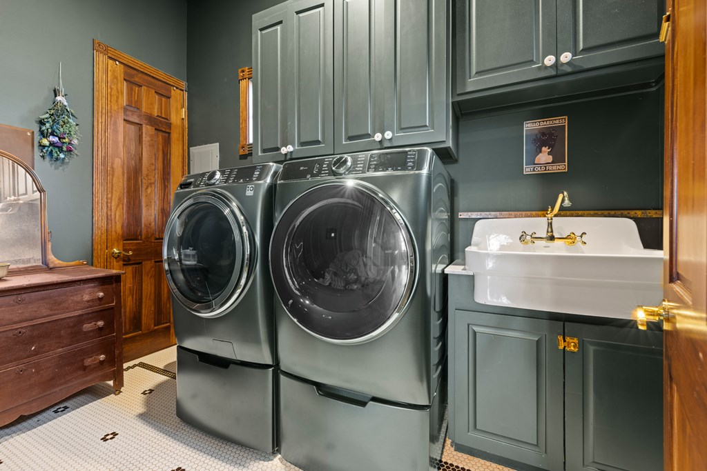 162 Flowering Sage Lane Comfort, TX 78013 - Photo 23 of 74 a utility room with sink dryer and washer