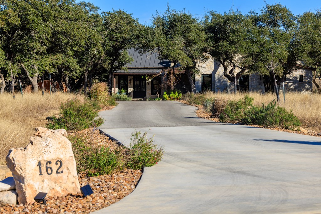 162 Flowering Sage Lane Comfort, TX 78013 - Photo 3 of 74 a front view of a house with a yard