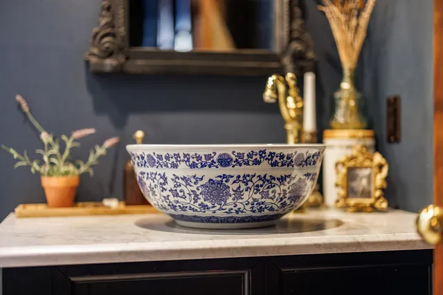 a backyard of a house with lots of green space and fountain