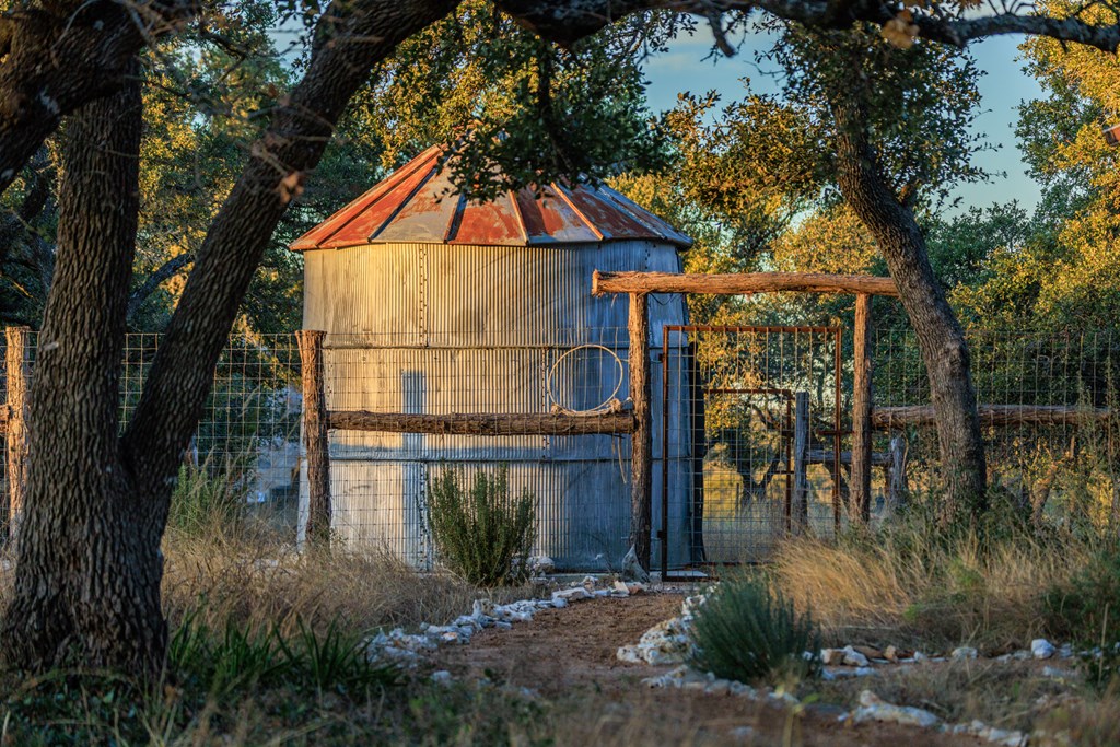 162 Flowering Sage Lane Comfort, TX 78013 - Photo 42 of 74 a backyard of a house with lots of green space and fountain
