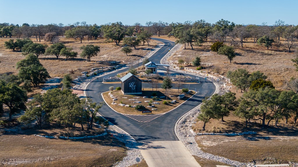 162 Flowering Sage Lane Comfort, TX 78013 - Photo 70 of 74 an aerial view of a house with a yard and lake view
