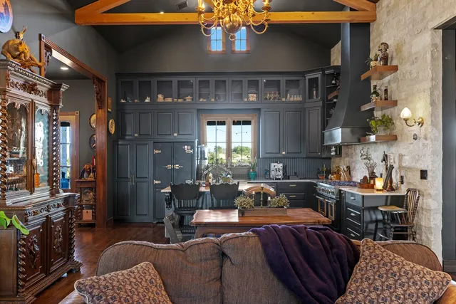 a kitchen with a table and chairs
