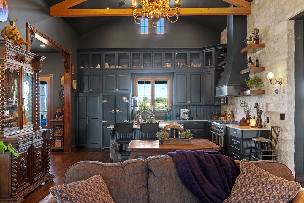 162 Flowering Sage Lane Comfort, TX 78013 - Photo 9 of 74 a living room with furniture a chandelier and a fireplace
