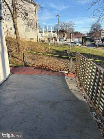 a view of a street with houses on the side