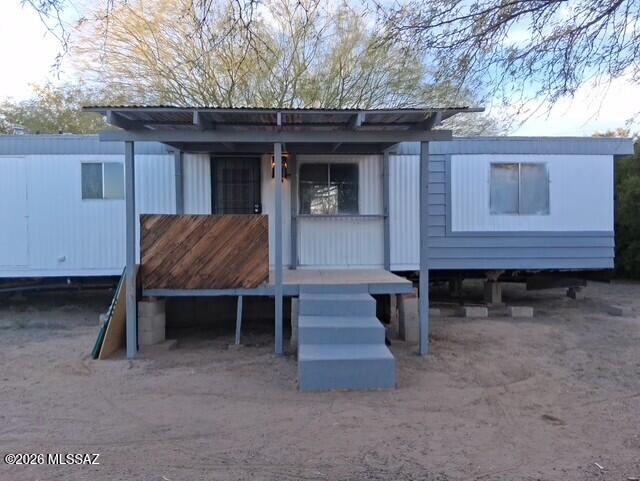 4401 North Musket Road Marana, AZ 85653 - Photo 4 of 15 a view of house with wooden deck and outdoor seating