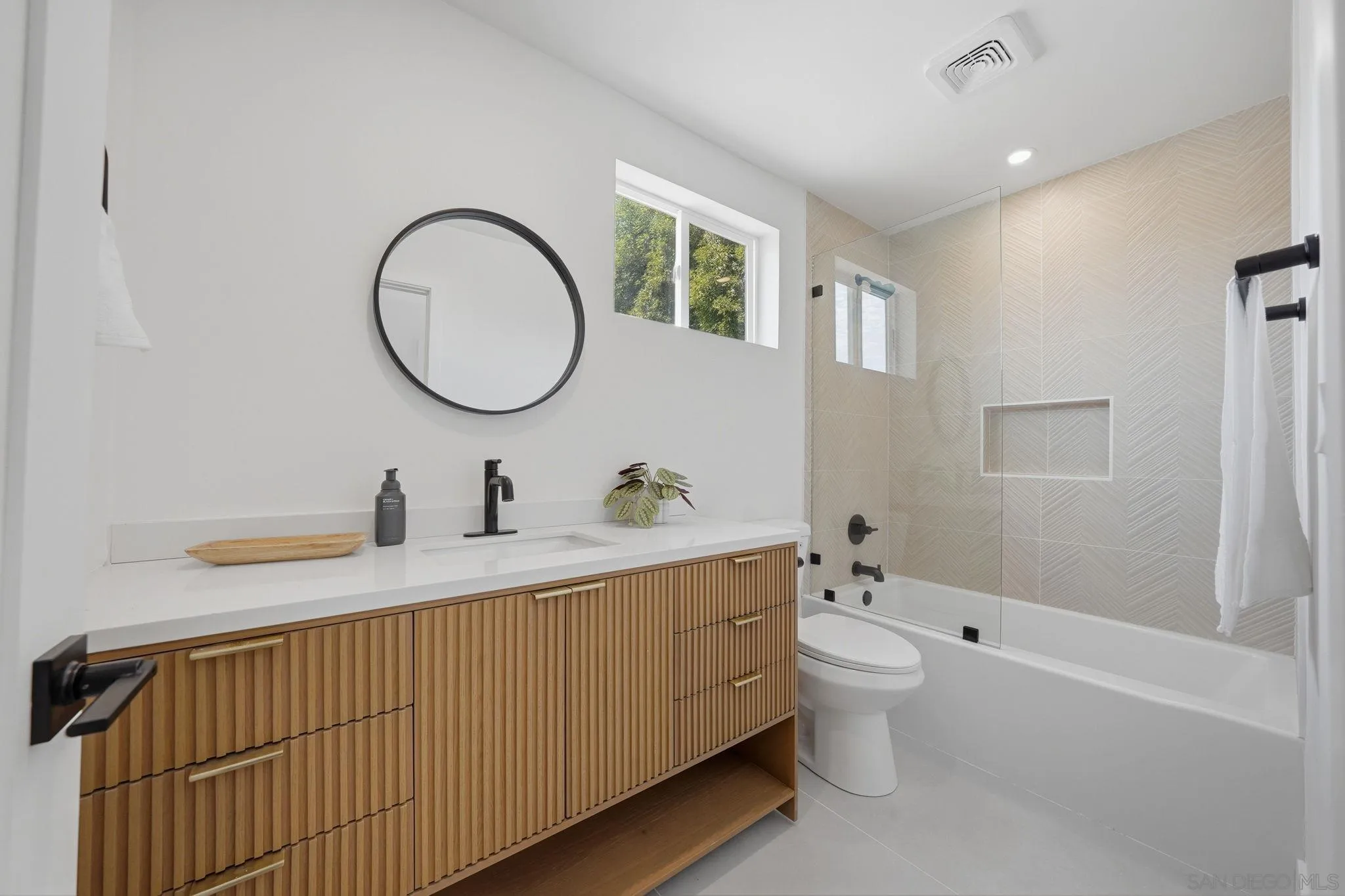 10440 Bosque Drive Lakeside, CA 92040 - Photo 43 of 47 a bathroom with a double vanity sink toilet mirror and shower