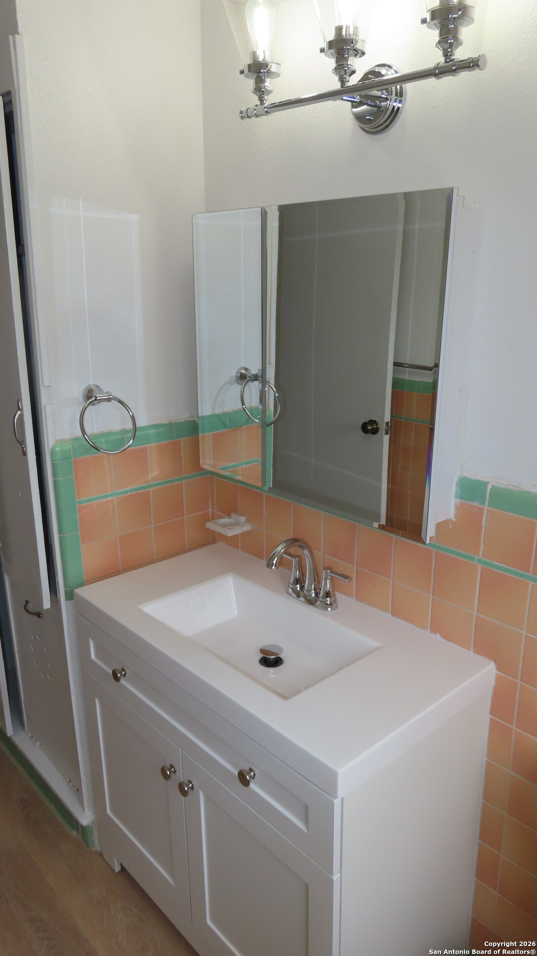3423 South WW White Road San Antonio, TX 78222 - Photo 12 of 20 a bathroom with a sink and a mirror