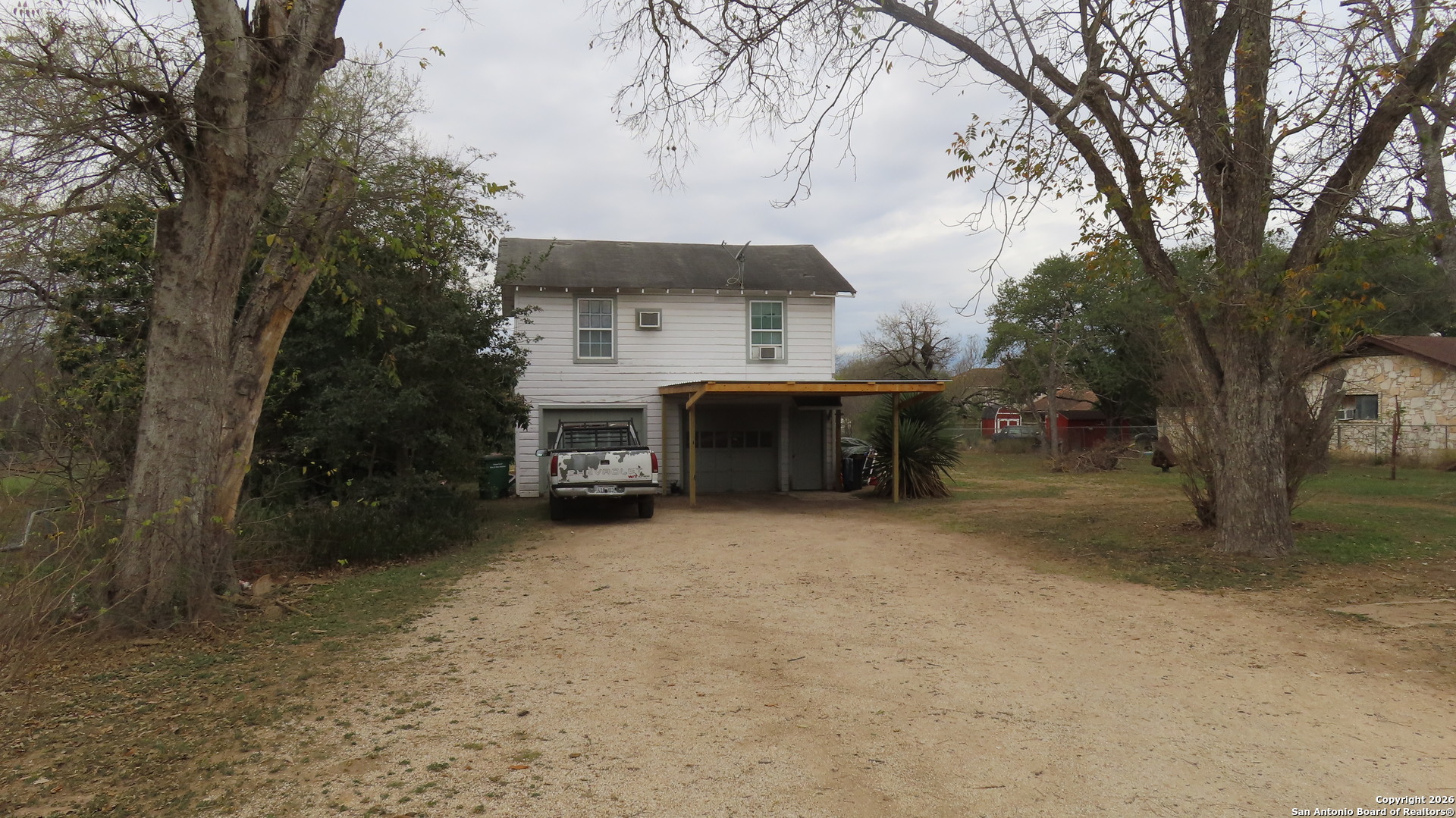 3423 South WW White Road San Antonio, TX 78222 - Photo 16 of 20 a view of a house with a yard and tree