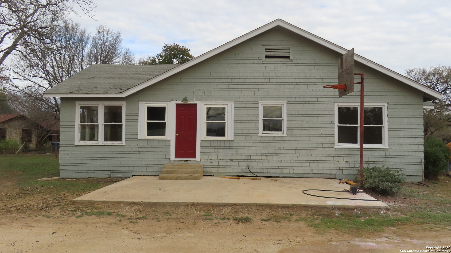 3423 South WW White Road San Antonio, TX 78222 - Photo 19 of 20 a front view of a house with a yard