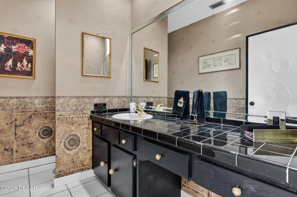 a bathroom with a double vanity sink and a mirror