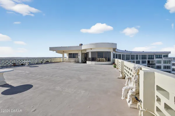 a view of a chair and tables in the room