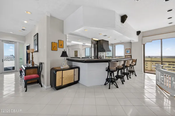 a kitchen with stainless steel appliances kitchen island granite countertop a sink and cabinets