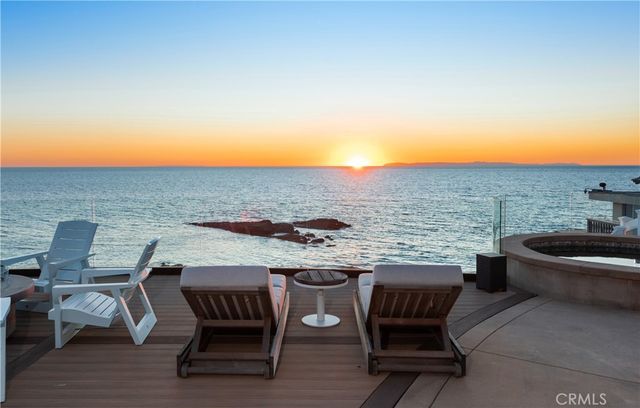 a terrace of a house with outdoor seating