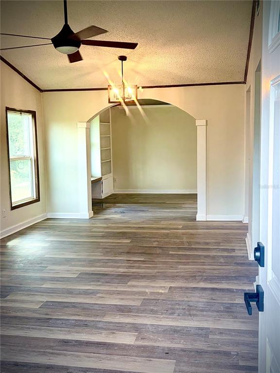 375 Pine Woods Road Ormond Beach, FL 32174 - Photo 4 of 16 a view of a ceiling fan in a room