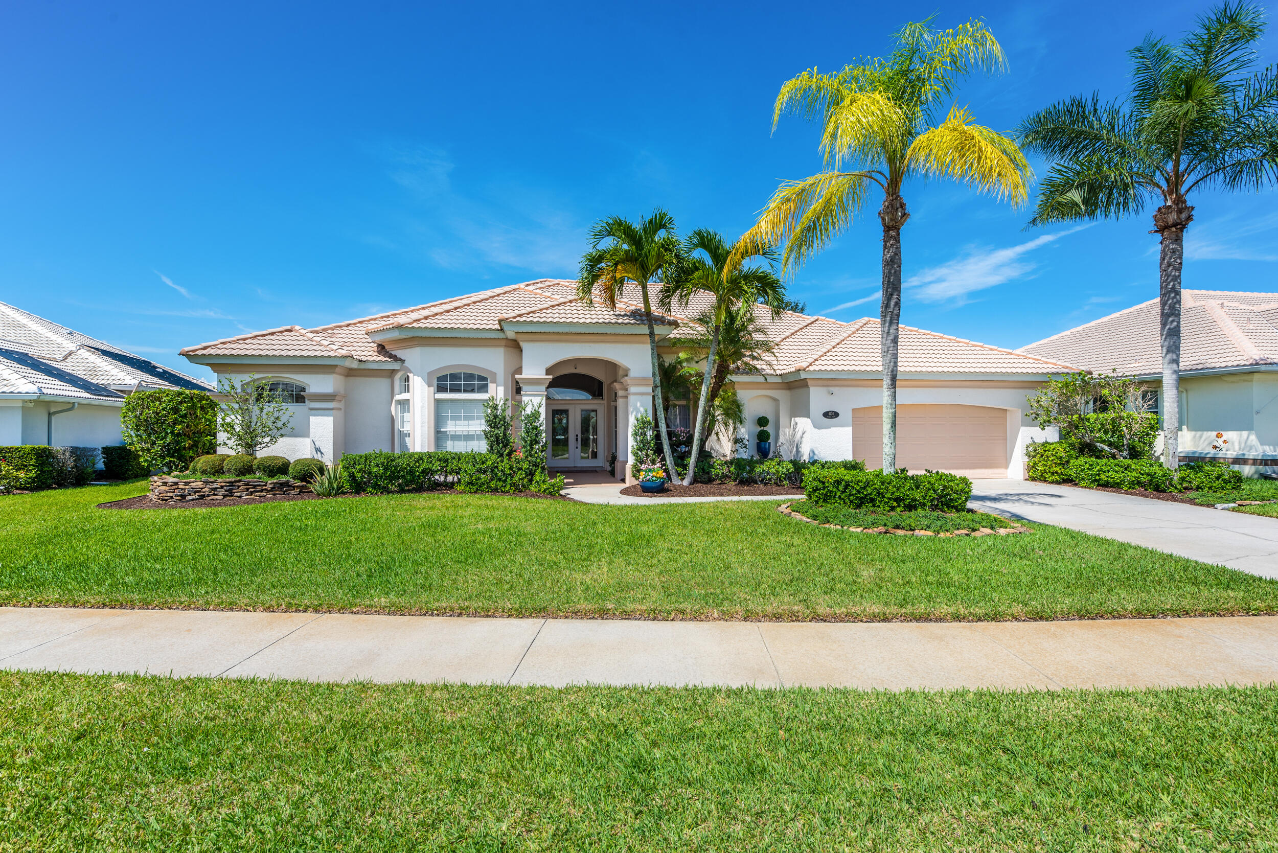 4130 Stoney Point Road Melbourne, FL 32940 - Photo 1 of 40 a palm tree sitting in front of a house with a big yard