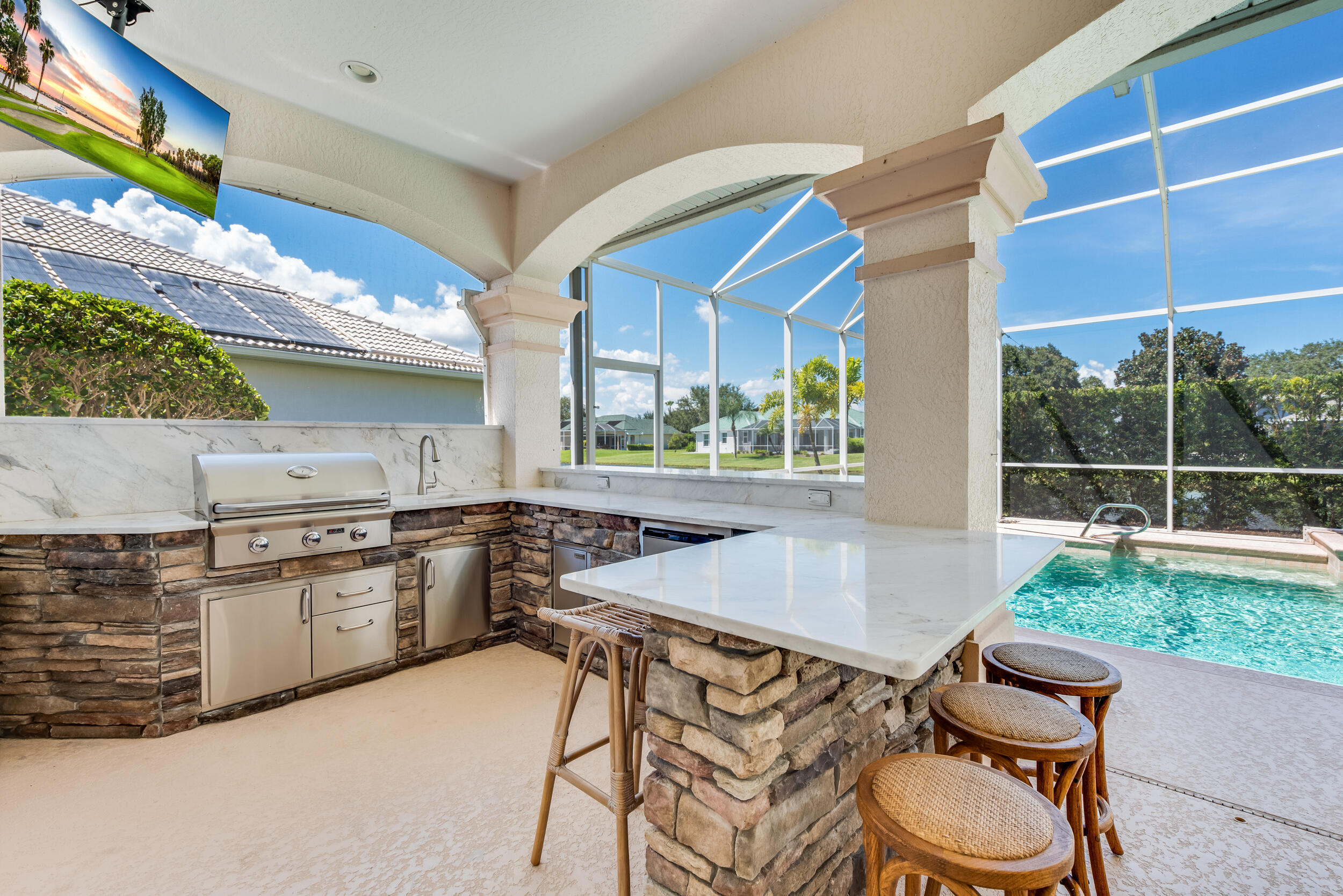 4130 Stoney Point Road Melbourne, FL 32940 - Photo 15 of 40 a kitchen with stainless steel appliances granite countertop a sink a stove and a wooden cabinets