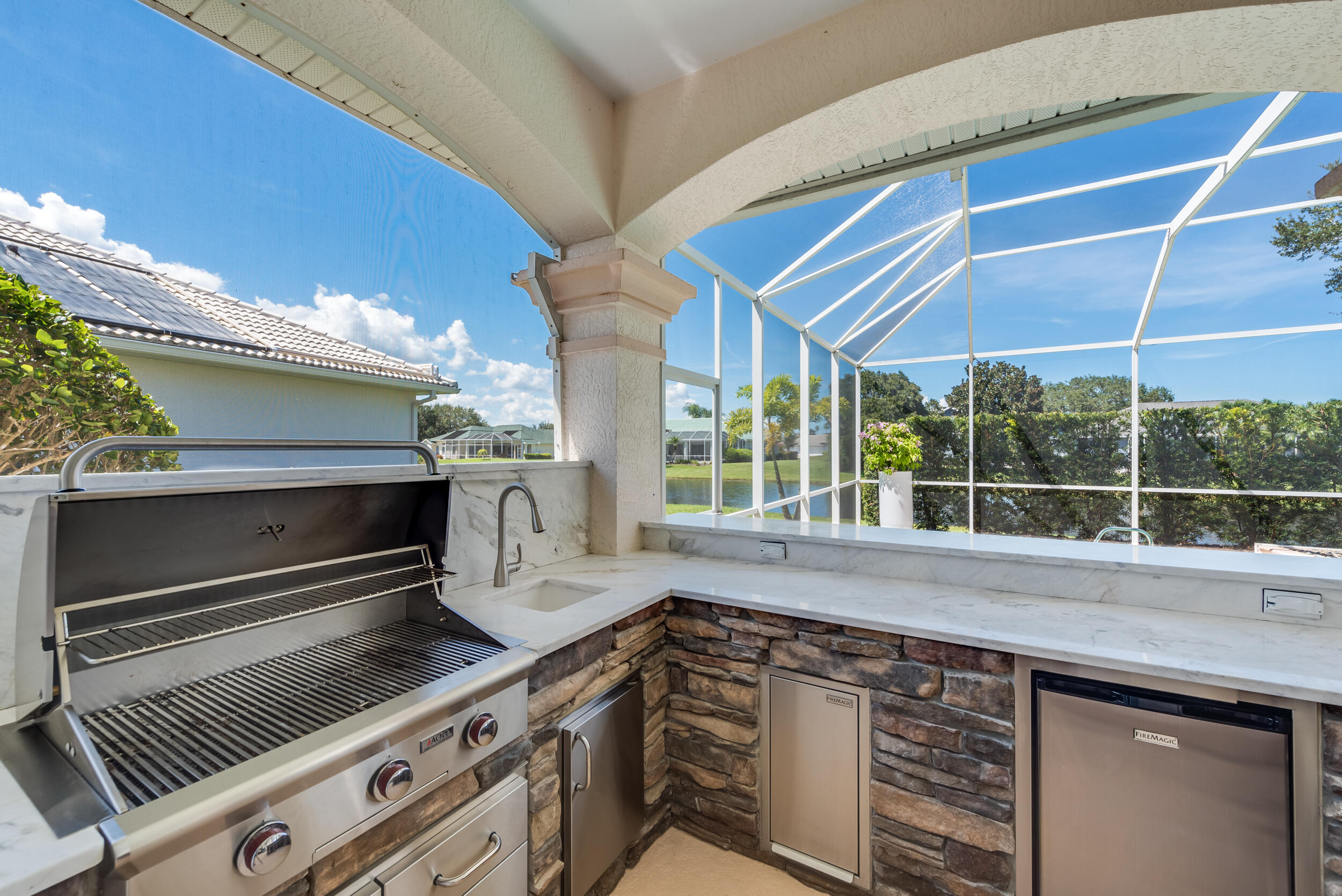 4130 Stoney Point Road Melbourne, FL 32940 - Photo 16 of 40 a kitchen with a stove and a sink