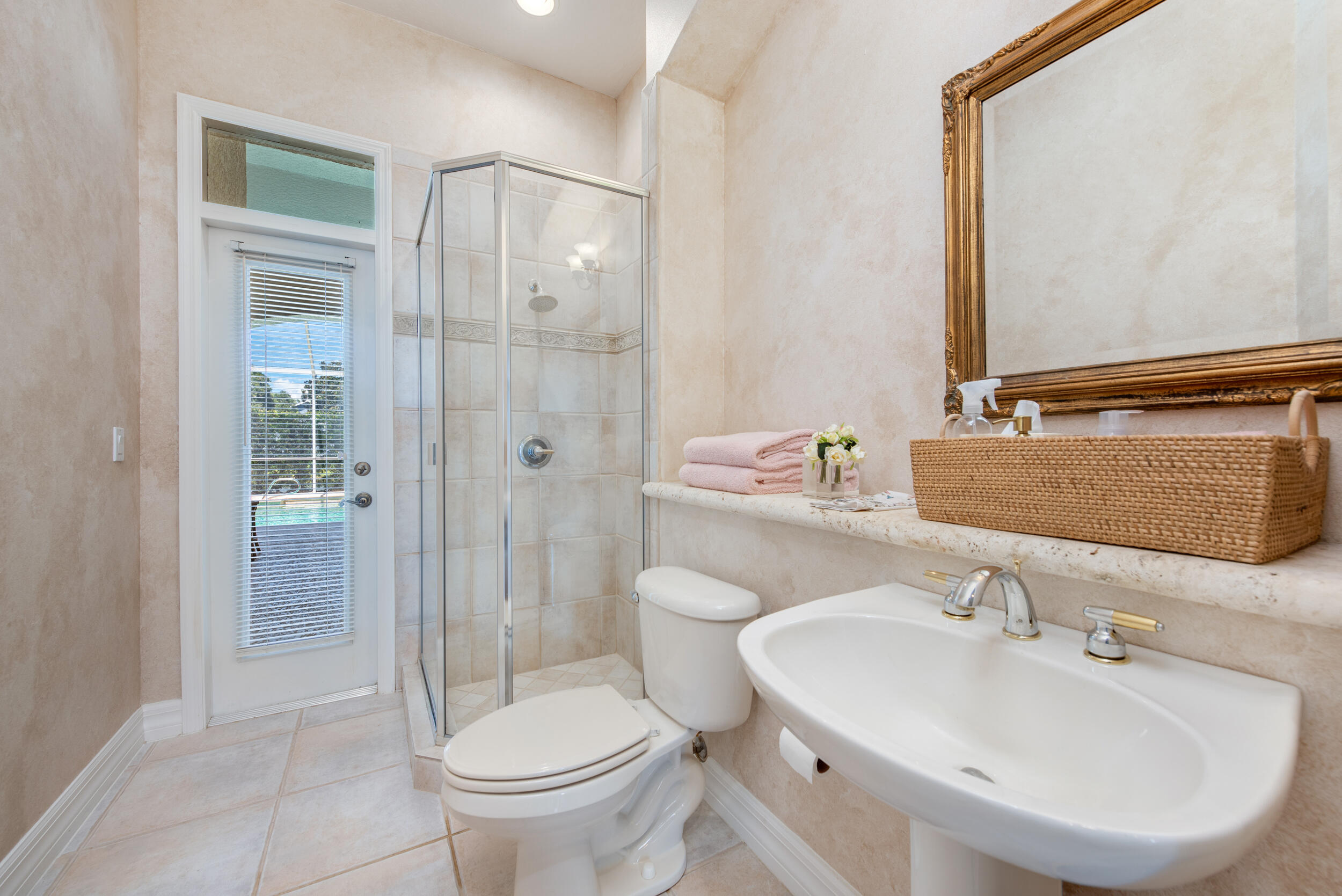 4130 Stoney Point Road Melbourne, FL 32940 - Photo 18 of 40 a bathroom with a sink toilet and shower