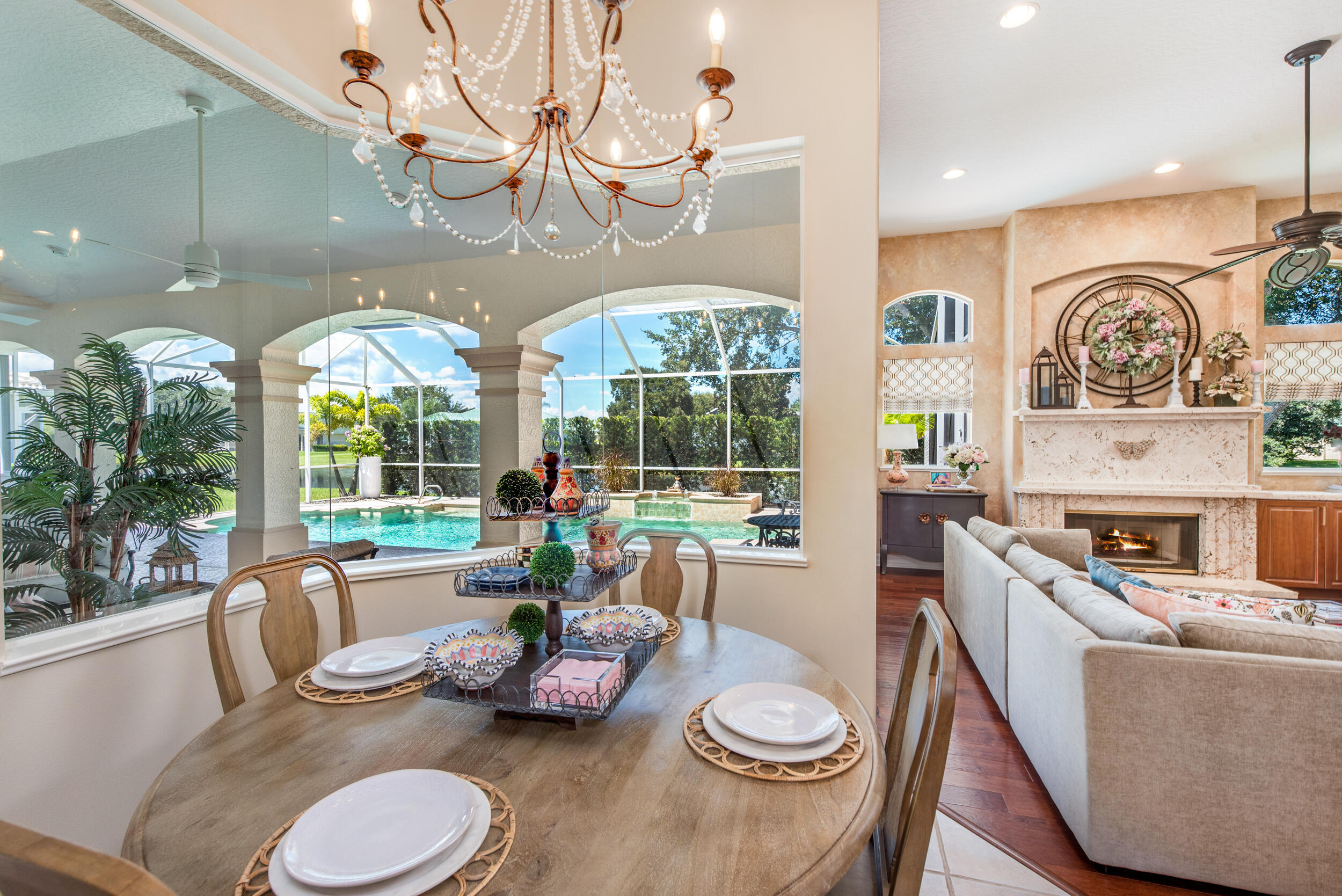 4130 Stoney Point Road Melbourne, FL 32940 - Photo 24 of 40 a dining room with furniture a chandelier and wooden floor