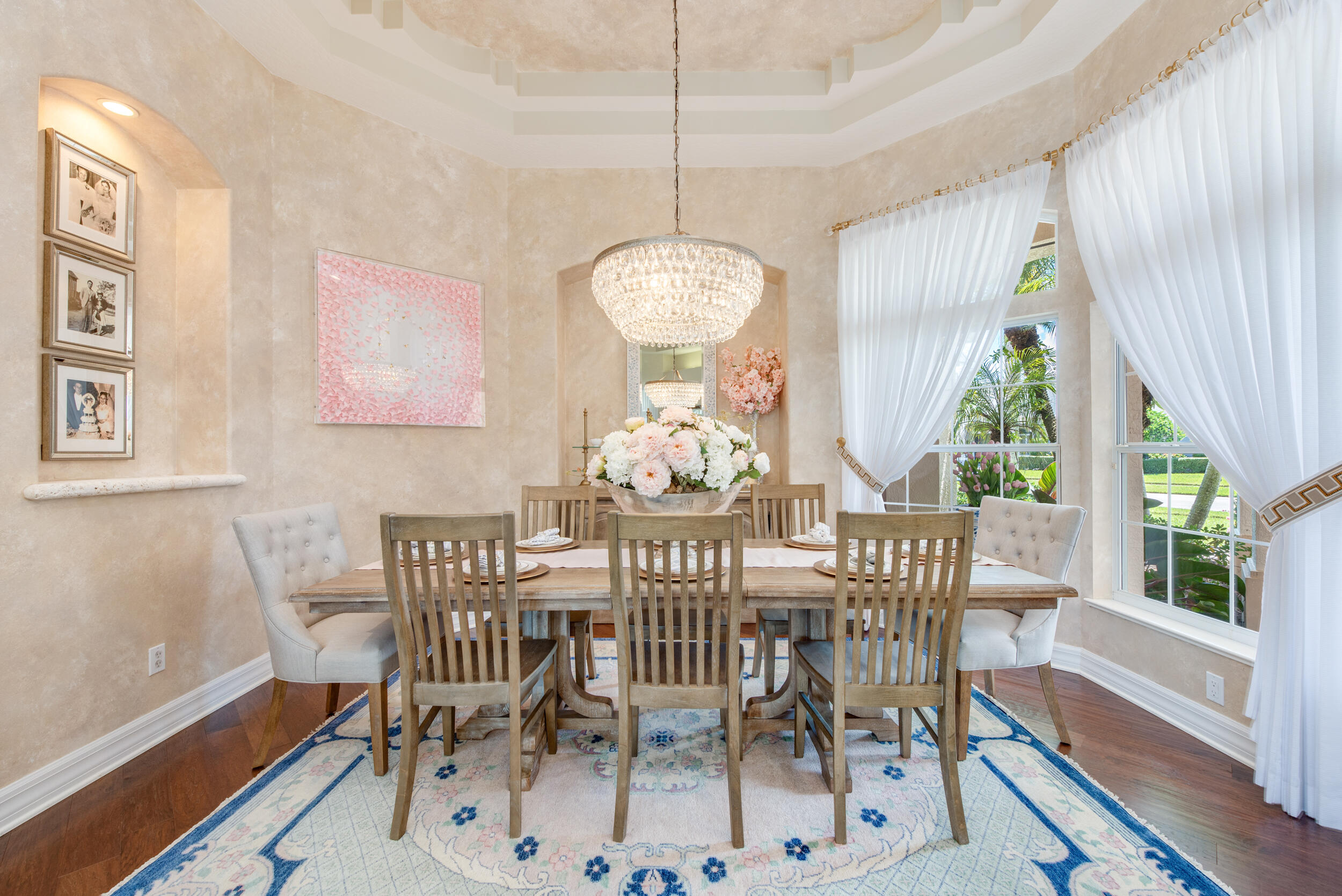 4130 Stoney Point Road Melbourne, FL 32940 - Photo 25 of 40 a dining room with furniture a chandelier and wooden floor
