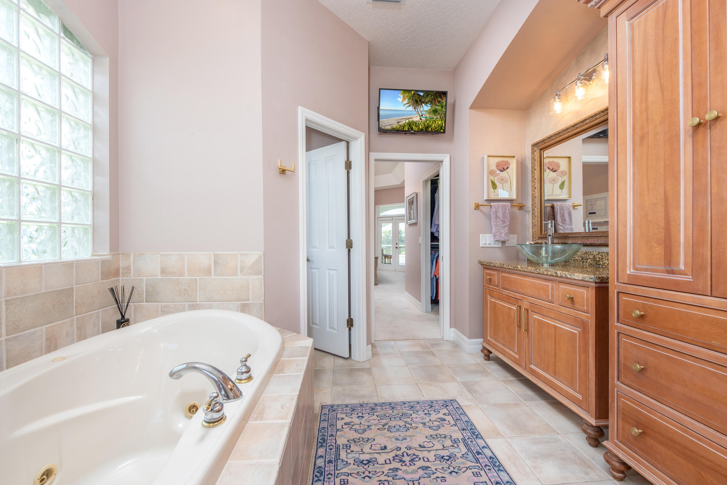4130 Stoney Point Road Melbourne, FL 32940 - Photo 30 of 40 a bathroom with a bathtub and a sink
