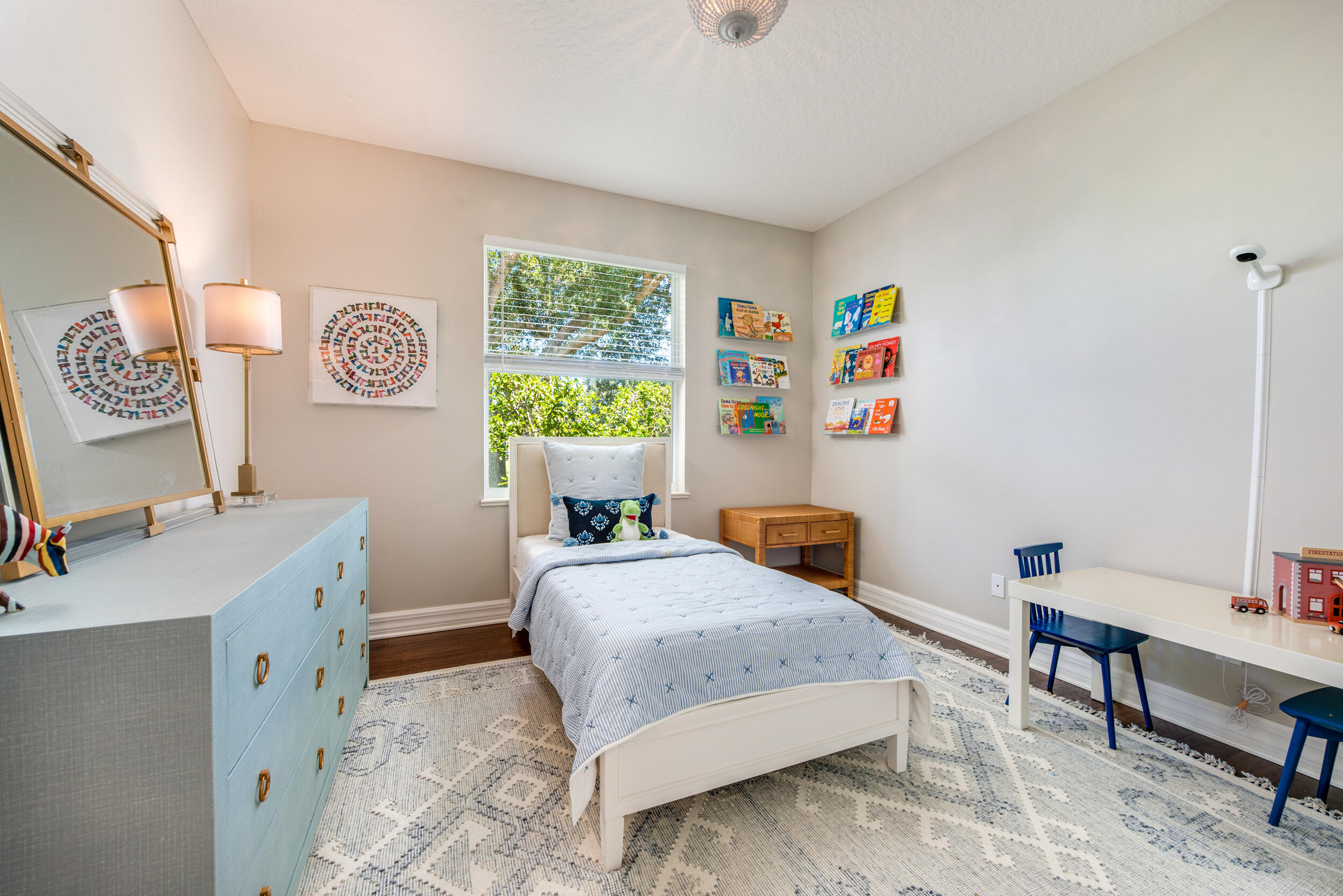 4130 Stoney Point Road Melbourne, FL 32940 - Photo 33 of 40 a bedroom with a bed and a desk