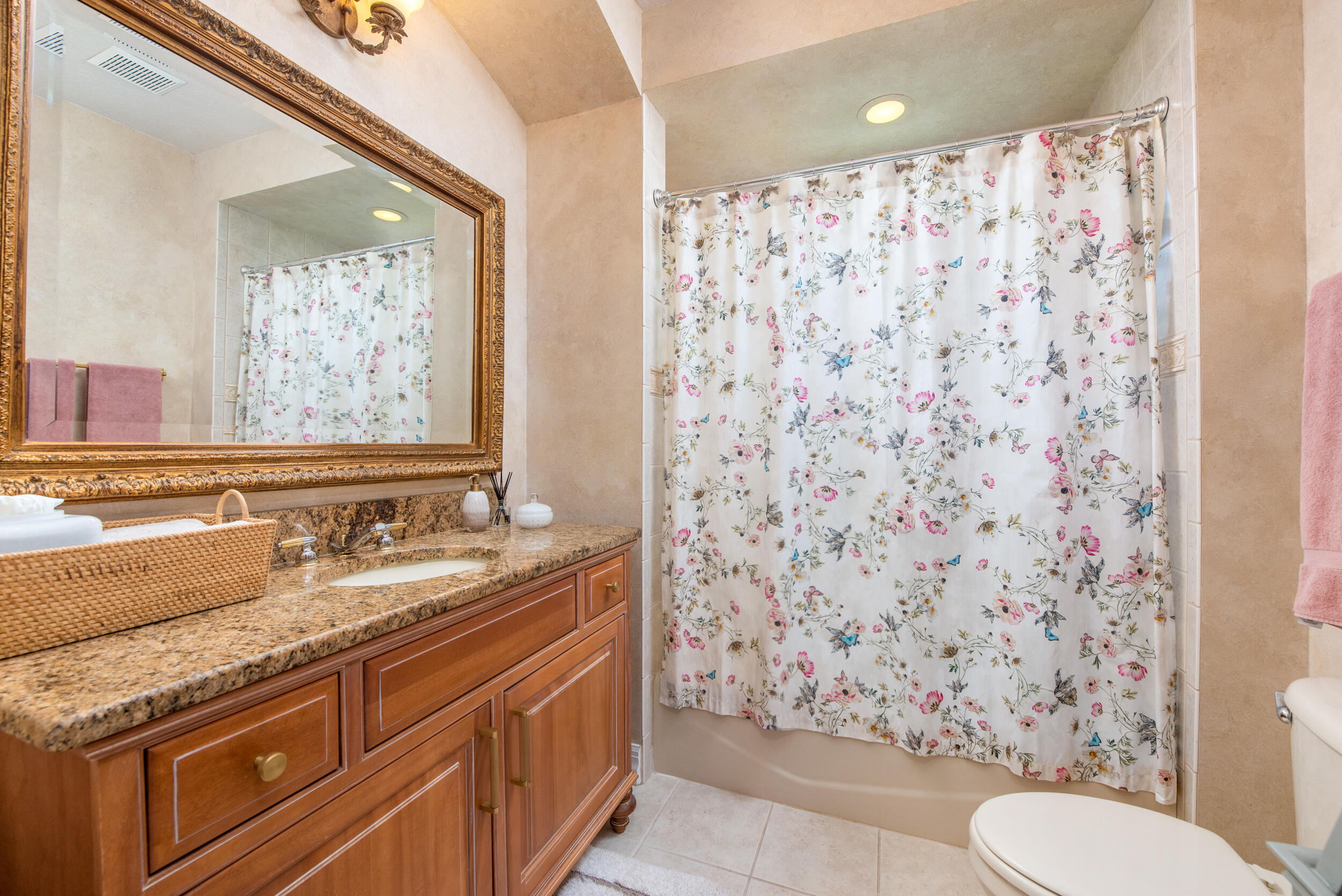 4130 Stoney Point Road Melbourne, FL 32940 - Photo 35 of 40 a bathroom with a granite countertop toilet sink and mirror