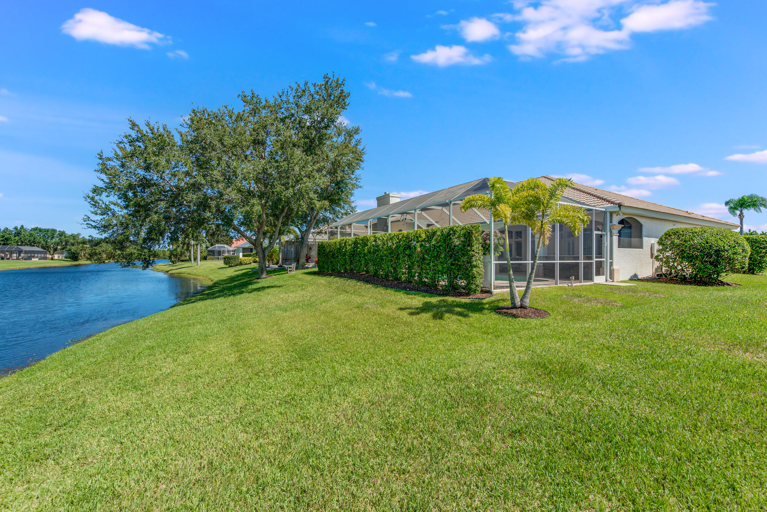4130 Stoney Point Road Melbourne, FL 32940 - Photo 5 of 40 a view of a house with a backyard and a patio