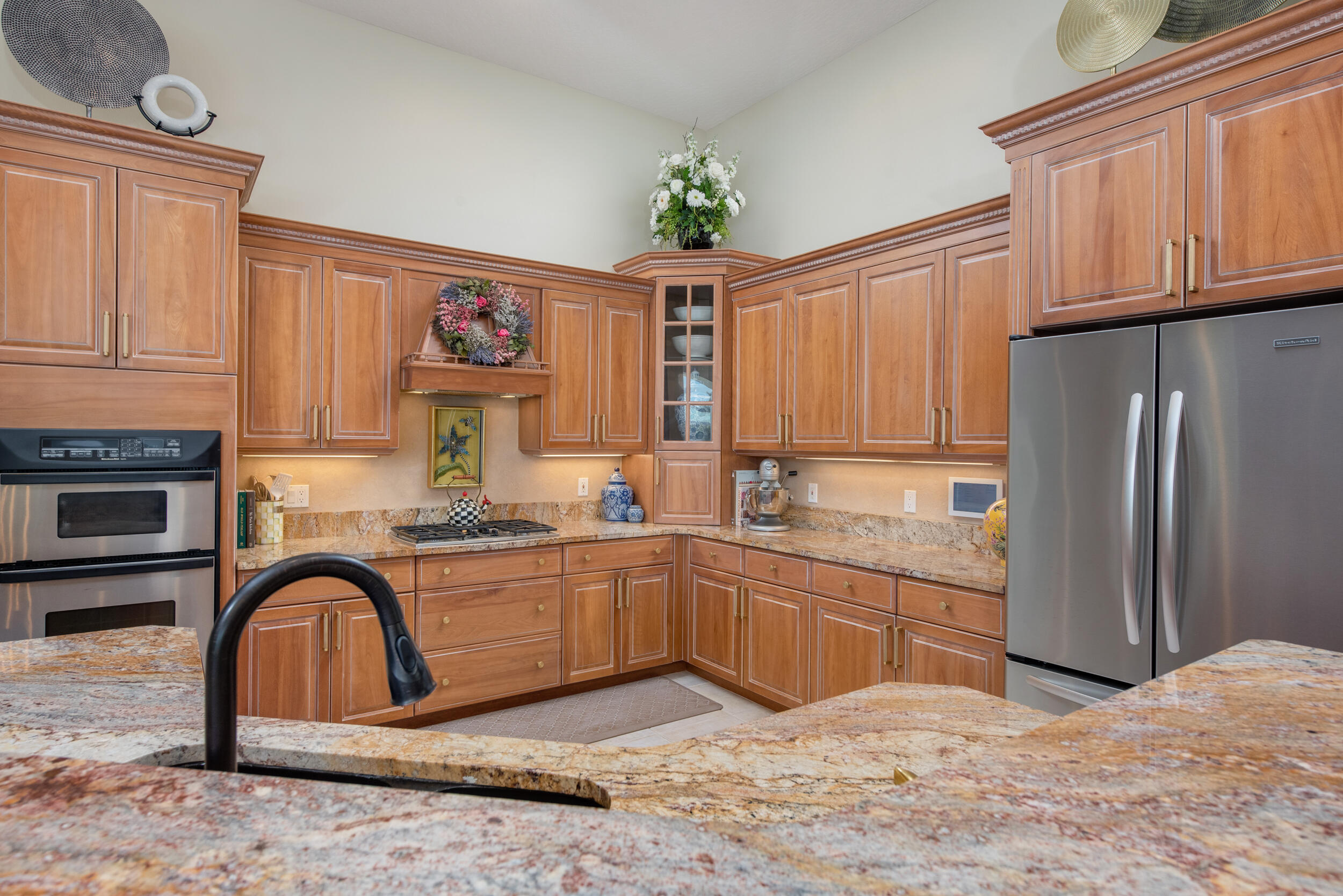 4130 Stoney Point Road Melbourne, FL 32940 - Photo 8 of 40 a kitchen with stainless steel appliances granite countertop a refrigerator and a stove top oven