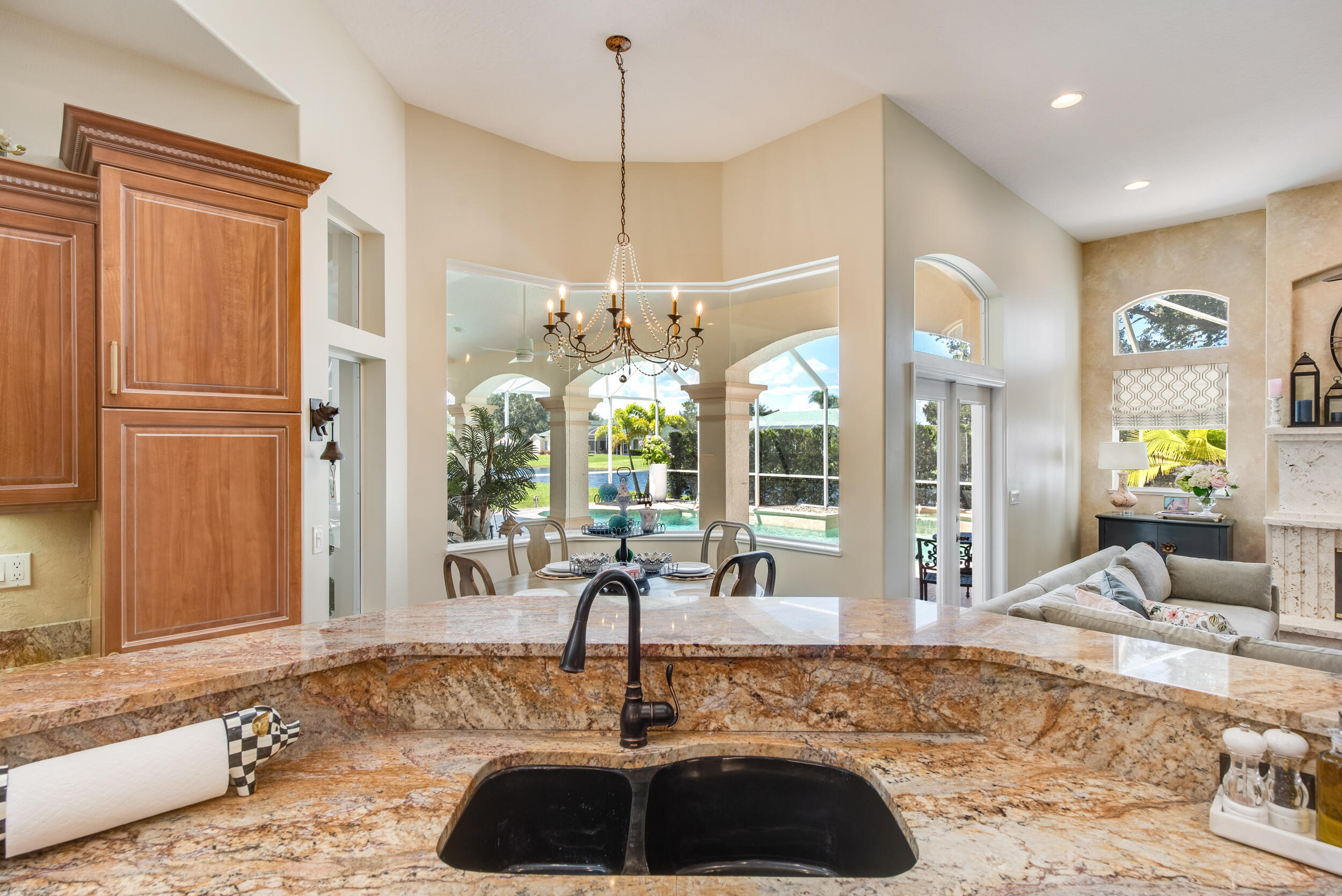 4130 Stoney Point Road Melbourne, FL 32940 - Photo 9 of 40 a living room with a bed furniture and a chandelier