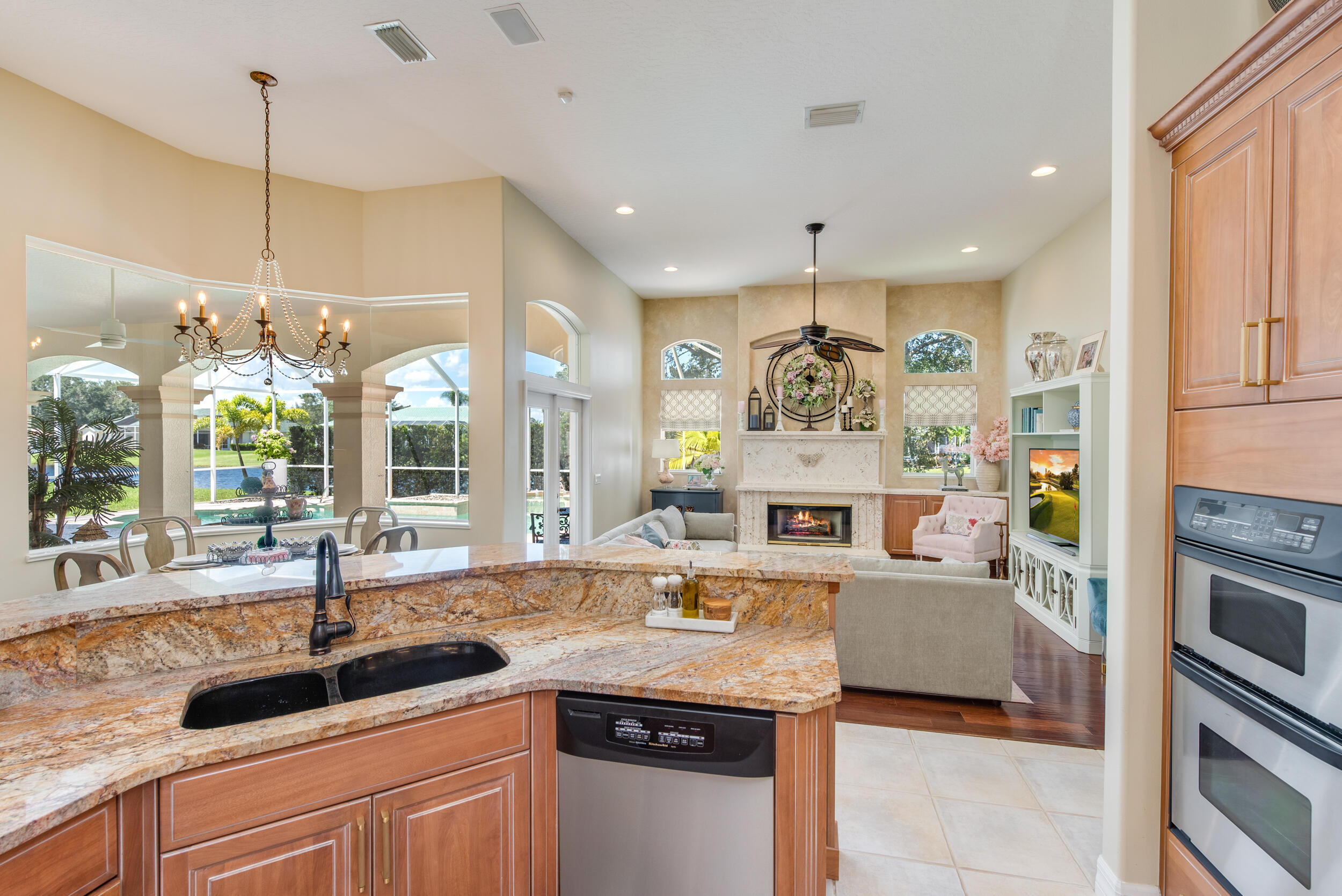 4130 Stoney Point Road Melbourne, FL 32940 - Photo 10 of 40 a kitchen with stainless steel appliances granite countertop a sink and a refrigerator