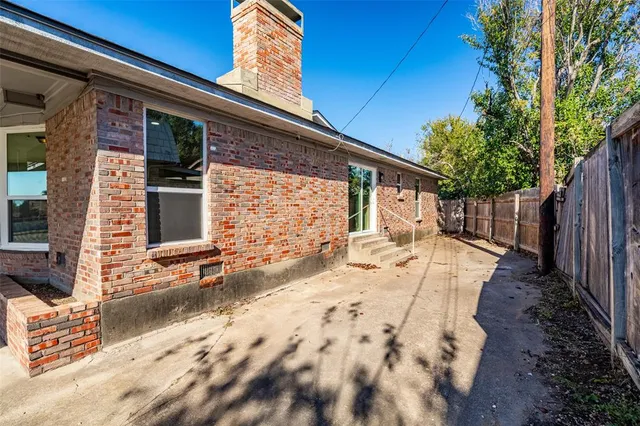 a view of a backyard with a patio