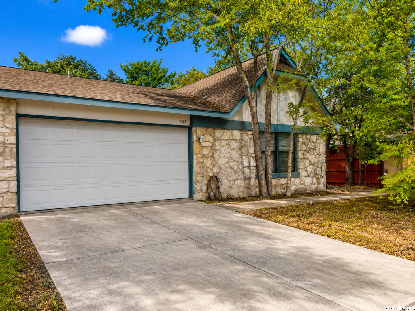 7315 Ridge Beach Drive Converse, TX 78109 - Photo 2 of 17 a view of a house with a patio and a yard