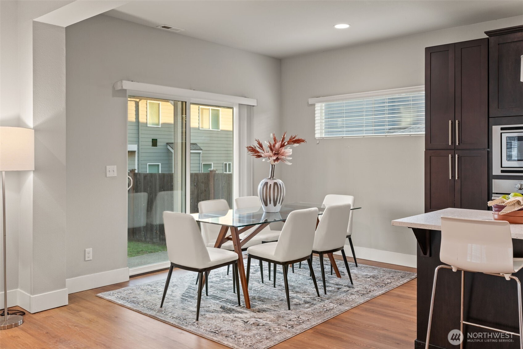 4408 214th Place Southeast Bothell, WA 98021 - Photo 11 of 33 a view of a dining room with furniture window and wooden floor