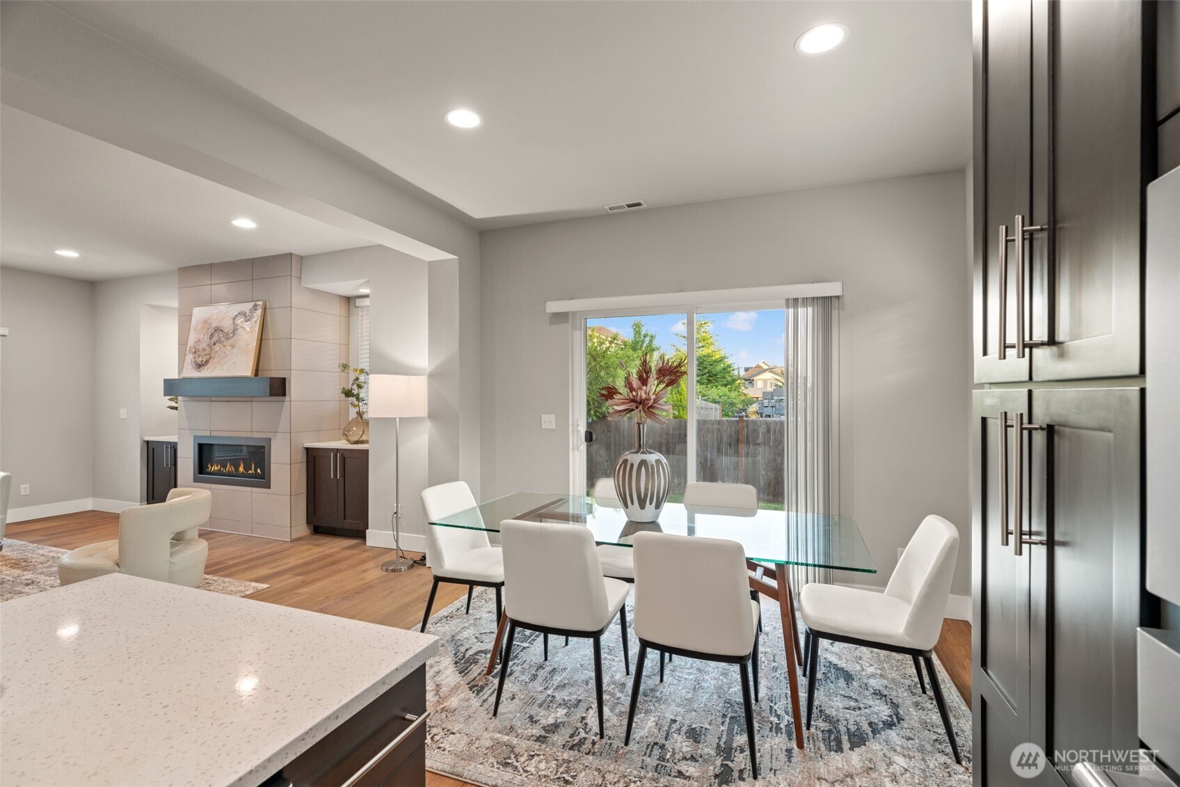 4408 214th Place Southeast Bothell, WA 98021 - Photo 17 of 33 a dining room with furniture and a chandelier